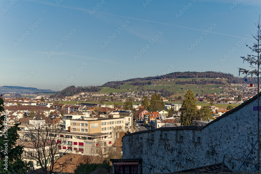 Scenic view over City of Thun with beautiful landscape and mountain panorama in the background on a sunny winter day. Photo taken February 21st, 2023, Thun, Switzerland.