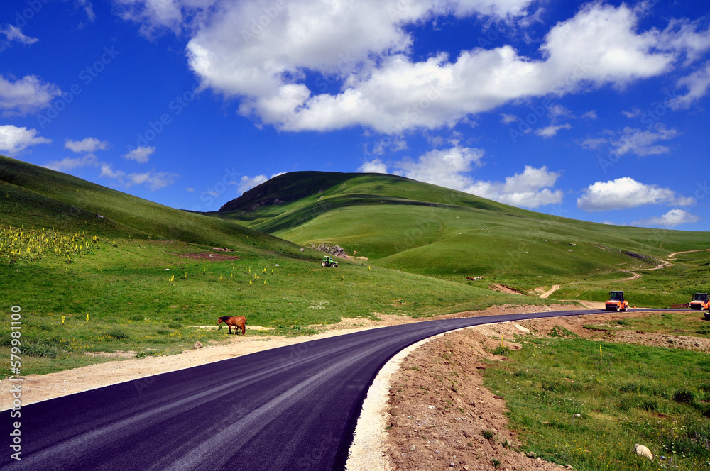 Beautiful mountain landscape with road and blue sky Beautiful mountain landscape with road and blue sky