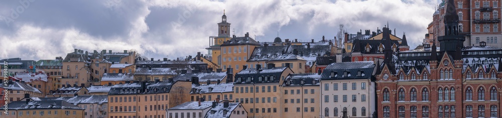 Panorama, old hoses block at the street Bastugatan and the vista point Monteliusvägen, a snowy day in Stockholm