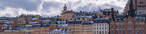 Panorama, old hoses block at the street Bastugatan and the vista point Monteliusvägen, a snowy day in Stockholm