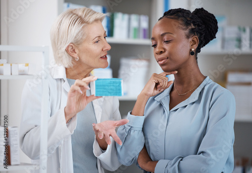 Suggestion, help and black woman with medicine from a pharmacist, dosage information and recommendation. Medical, sick and doctor reading label on a box of pills with an African patient for medicare