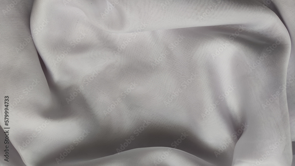 Fototapeta premium Abstract chiffon fabric background white texture from the waves and the irregularities that create the frame. Light, delicate, beautiful curtains