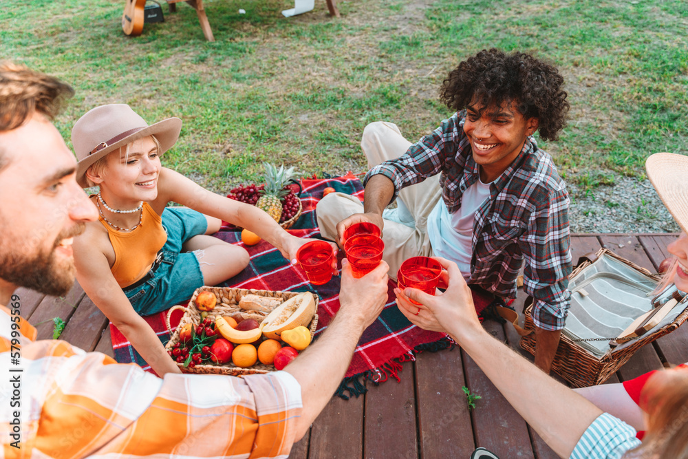 Fototapeta premium Friends have a picnic outdoor in a sunny day