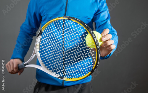 Man holding tennis ball and racket. Sport. Hobby © andranik123