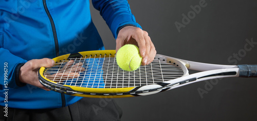 Man holding tennis ball and racket. Sport. Hobby