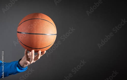 Caucasian man holding basketball ball. © andranik123