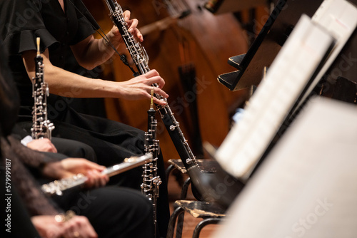 A musician playing the English horn during a live classical symphony orchestra performance