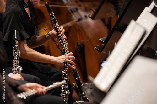 A musician playing the English horn during a live classical symphony orchestra performance