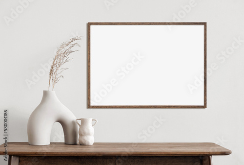 Foto Blank wooden picture frame mockup on wall in modern interior