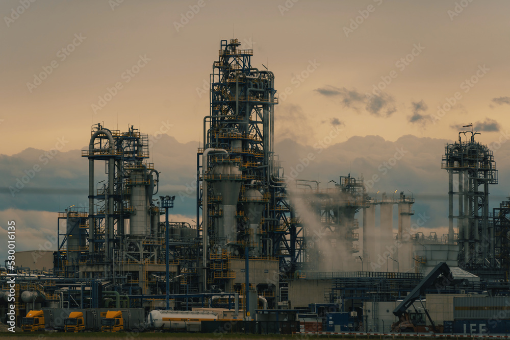 industry tower of rafinery with tubes and smoke and fog industry tower of rafinery with tubes and smoke and fog