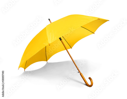 Yellow umbrella isolated on a white background photo