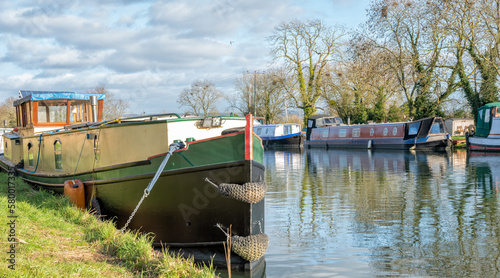 Canal boats moored near Patch Bridge on the Gloucester - Sharpness Ship Canal, United Kingdom