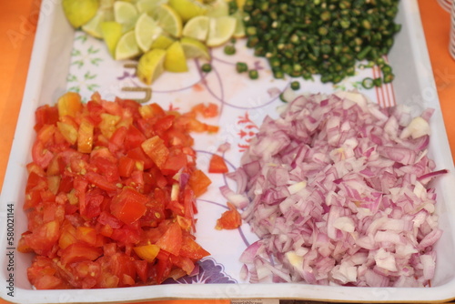 raw minced  onion , tomato   lemons , and green chilli  with vegetables © Arun Davidson 