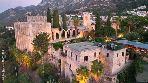 Bellapais Monastery aerial sunset view in Bellapais village, North Cyprus photo