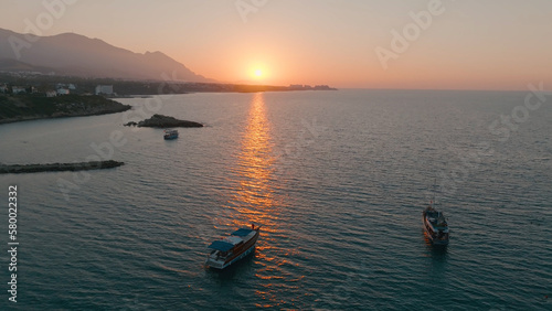 Aerial drone view of boat is sailing on the sea in Kyrenia, North Cyprus