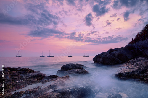 Sea landscape with sunset sky and boats on the horizon © luengo_ua