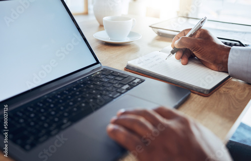 Hands, laptop and man writing notes for business schedule, office administration and reminder. Closeup worker, computer planning and notebook of ideas, information and strategy planner at table