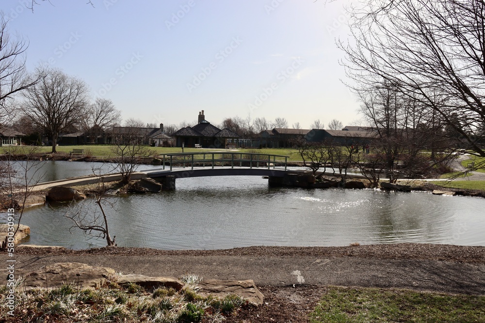 The wood bridge over the pond in the park.