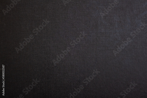 Black paper texture or background. Blank black sheet with copy space.