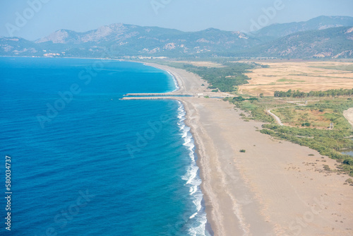 Fototapeta Naklejka Na Ścianę i Meble -  Aerial view over Dalaman beach toward Sarigerme on the Meditteranean coast of Turkey.