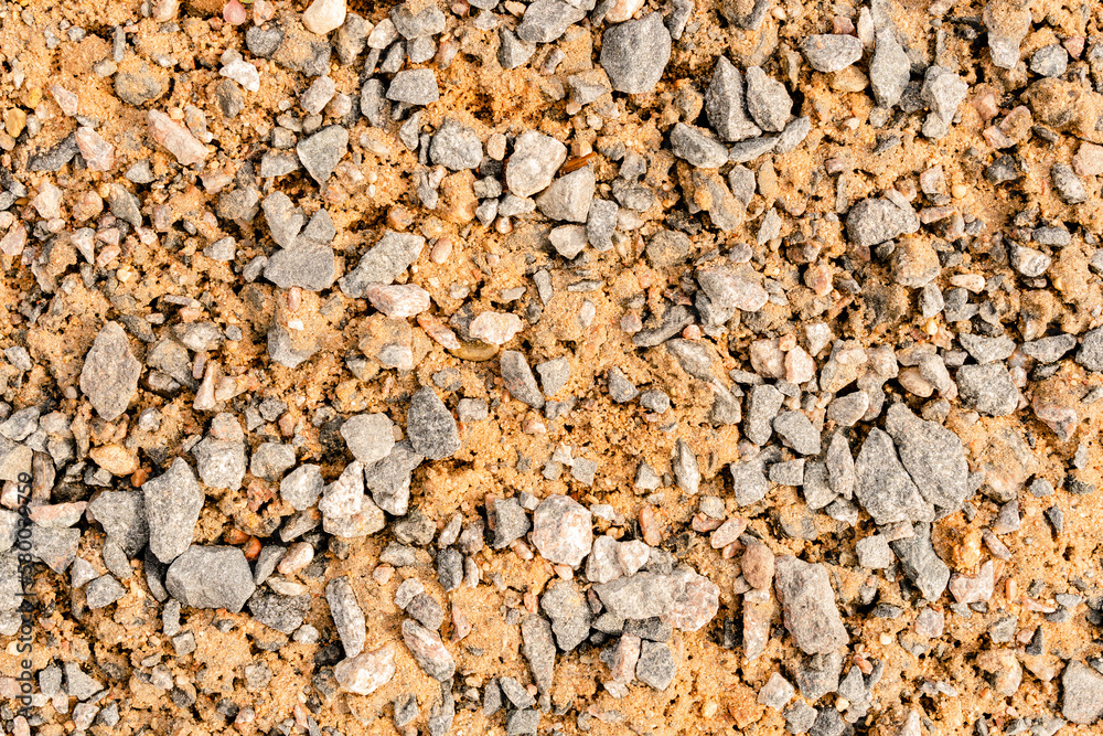 Pieces of gravel lying on the sand. Pieces of gravel lying on the sand.