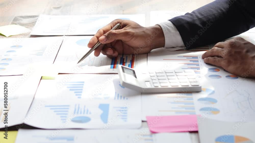 Businessman analyzing investment charts and budget management planning. Accounting and Finance Businessman analyzing investment charts and budget management planning. Accounting and Finance