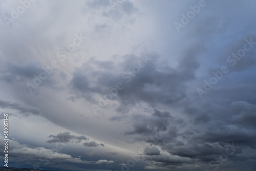 Sky with dramatic clouds. The sun shines through the clouds. The sky for exchange in the photo.