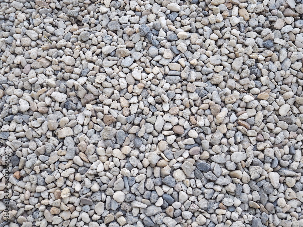 Small boulders on road or decorate your home garden. Pebbles of different shapes, sizes, and colors. Outdoor background design
Small boulders on road or decorate your home garden. Pebbles of different shapes, sizes, and colors. Outdoor background design
