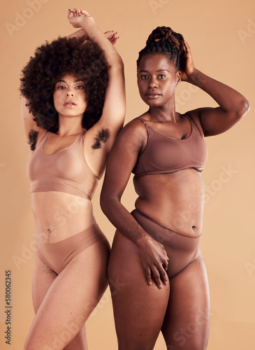 Body positive, empowerment and black women with body hair for natural beauty, care for skin and confidence on brown studio background. Self love, wellness and African model friends with hairy armpit