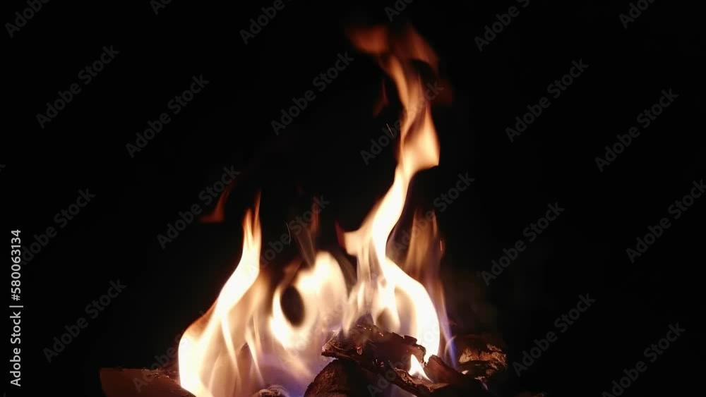 The hot embers of burning wood log fire. Firewood burning on stove. The hot embers of burning wood log fire. Firewood burning on stove.