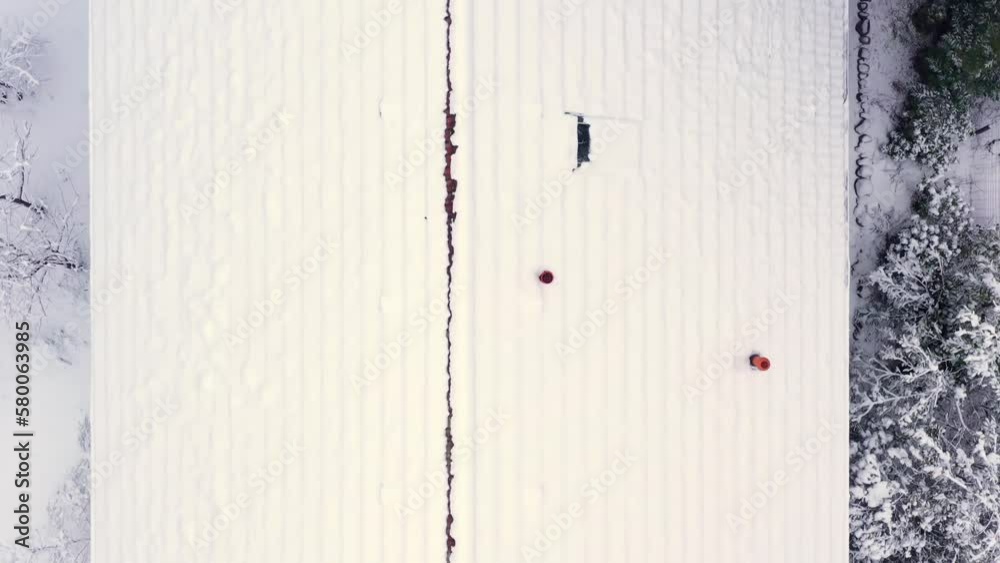 Top down video of the flyover over the snow covered roof of a family home in Germany Top down video of the flyover over the snow covered roof of a family home in Germany