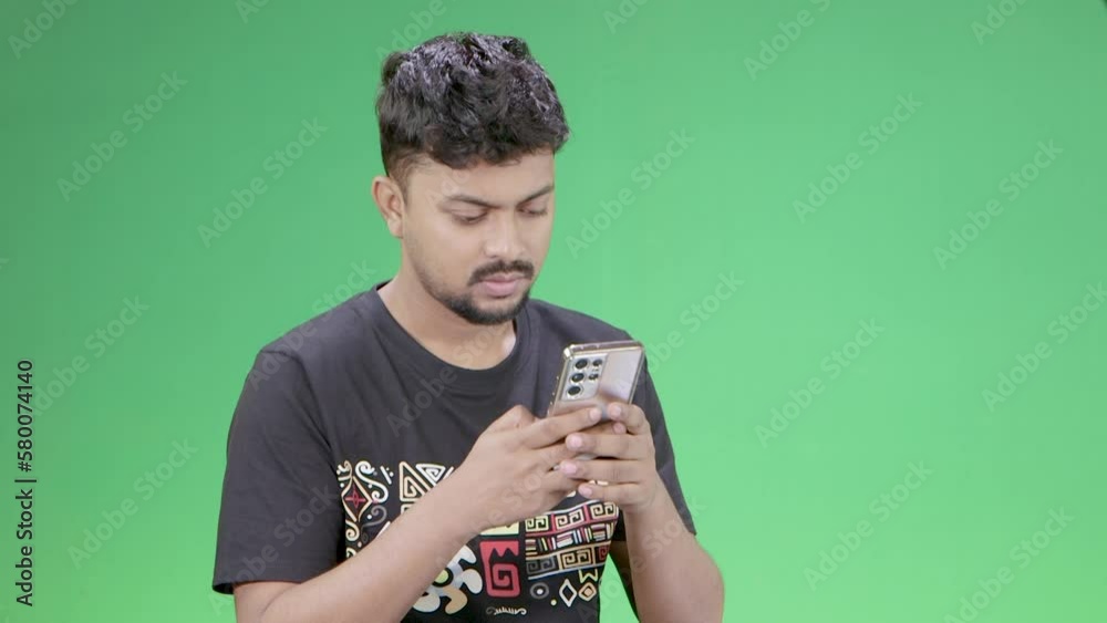 young person with a phone, texting, scrolling, smiling on green screen young person with a phone, texting, scrolling, smiling on green screen