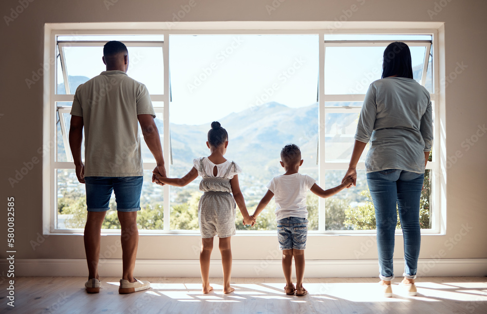 Love, back view and family holding hands by window looking at scenic view of nature, trees and mountain. Bonding, affection and mom and dad standing with kids in new apartment, happy in family home