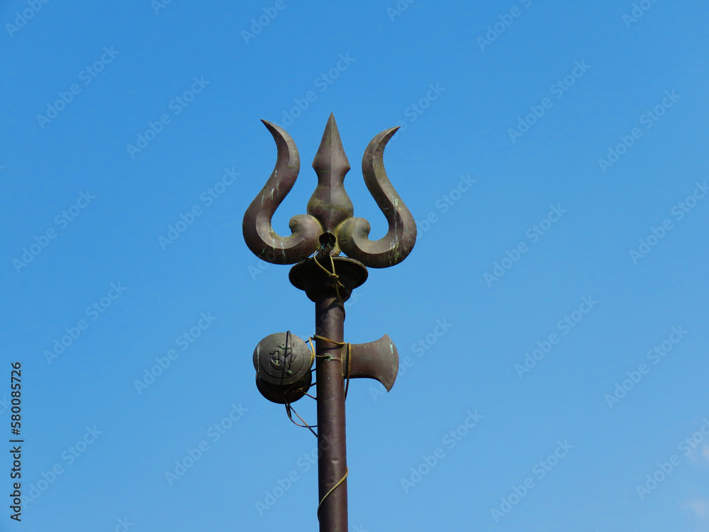 Trident weapon, and ornaments of Lord Shiva. Weapon of God Shiva. Trishul and damaru drum.