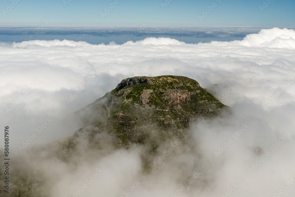 Drone view of Madeira Mountains Pico do Arieiro, Portugal. Rocky peaks over the clouds.