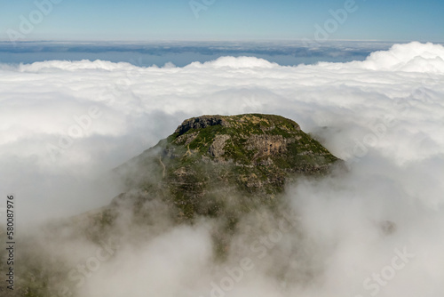Drone view of Madeira Mountains Pico do Arieiro, Portugal. Rocky peaks over the clouds.