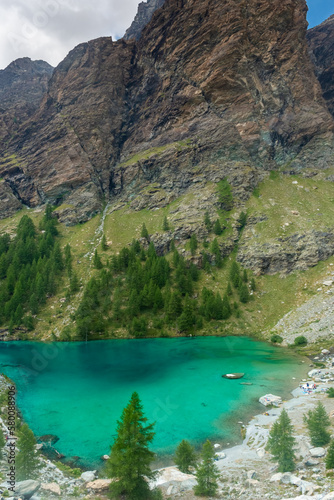 Fototapeta Naklejka Na Ścianę i Meble -  The crystal clear water of the Blue Lake of Ayes,  Italian Alps