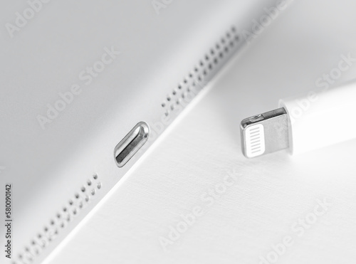Apple Lightning Connection port on Ipad. Connection used to connect mobile devices such as iPhones, iPads or iPods to computers.