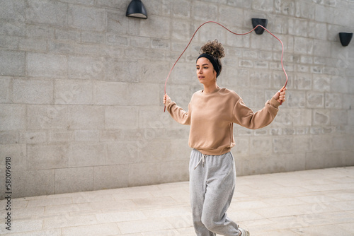 one woman young adult caucasian female with jumping rope training photo