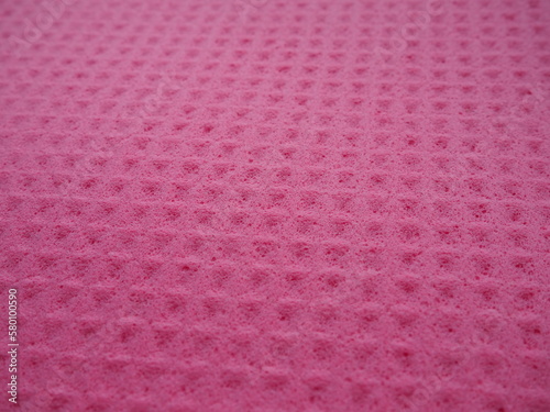 Sponge fibers sponge texture pattern surface close-up pink magenta background