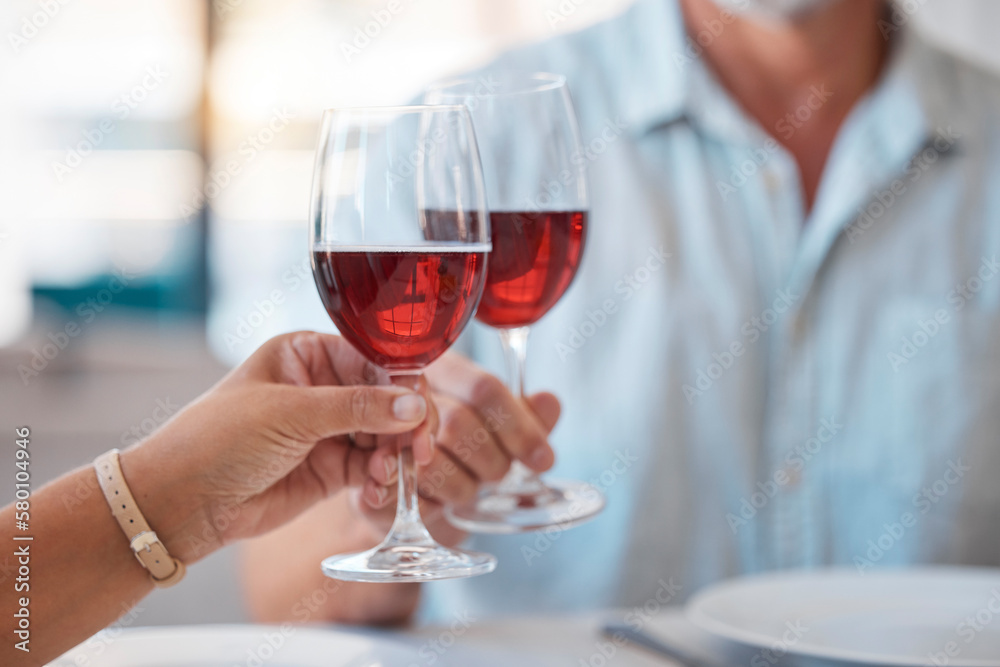 Hands, wine glasses and cheers for celebration dinner, date or table in thanks for fine dining at home. Hand of couple toasting with wine for relationship, romance and clinking glass for dating love Hands, wine glasses and cheers for celebration dinner, date or table in thanks for fine dining at home. Hand of couple toasting with wine for relationship, romance and clinking glass for dating love