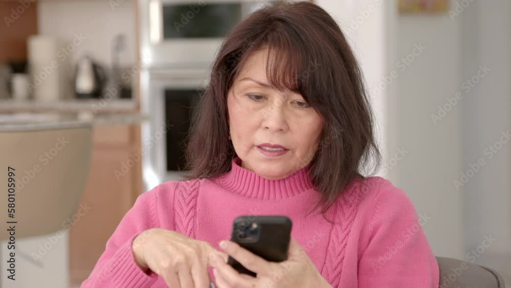 Close up attractive woman shopping online mobile phone excited at e-commerce purchase sitting Close up attractive woman shopping online mobile phone excited at e-commerce purchase sitting