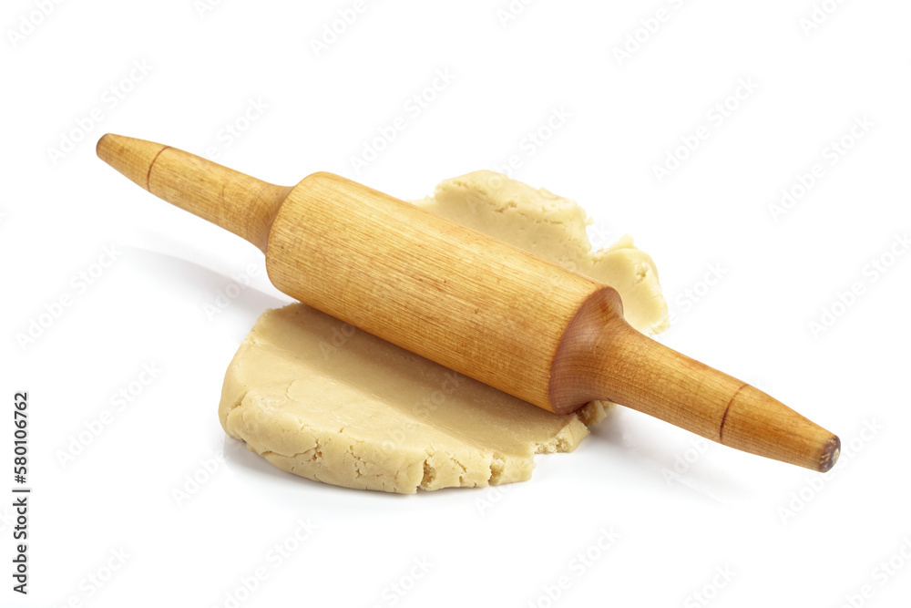 Dough and rolling pin isolated on white.