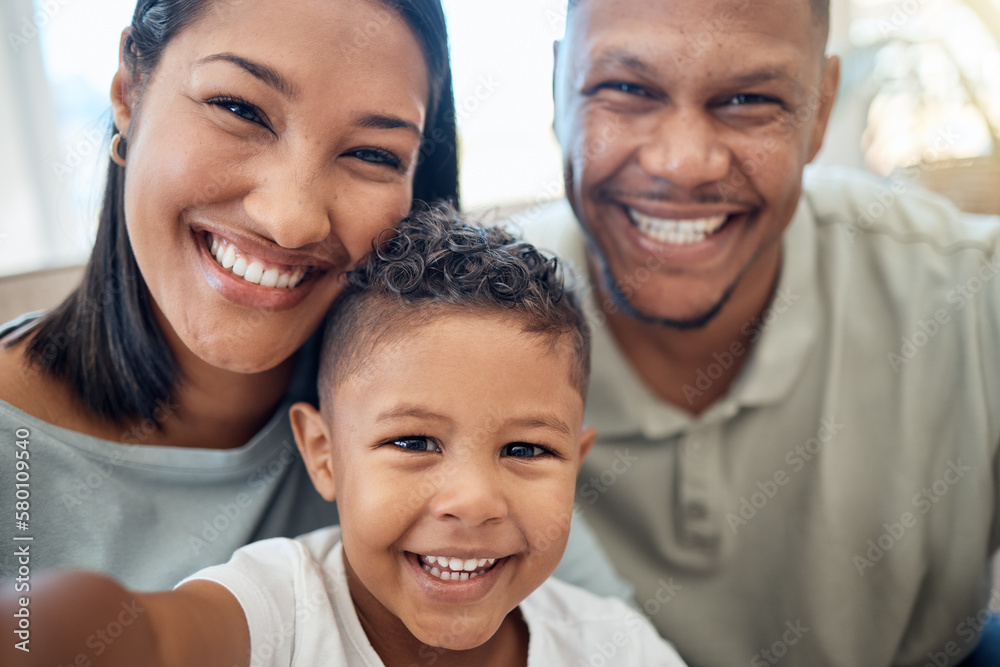 Mother, father and child in a selfie or portrait in the house living room bonding and enjoying holidays as a family. Mama, dad and happy young boy kid or boy with a big smile loves pictures in Mexico Mother, father and child in a selfie or portrait in the house living room bonding and enjoying holidays as a family. Mama, dad and happy young boy kid or boy with a big smile loves pictures in Mexico