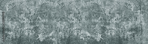 Cracked concrete wall panoramic texture. Old weathered cement construction. Grunge light background