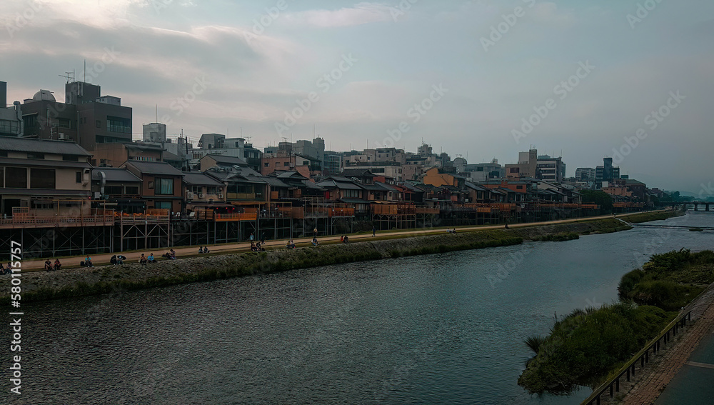 Old, traditional residential district in Kyoto by the river.