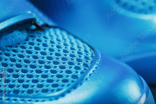 Macro Ventilation grid of blue sneakers in full screen