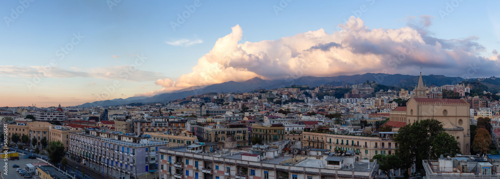 Homes and Apartment Buildings in a touristic city Messina, Sicilia, Italy. Cloudy Sunrise Sky. Aerial