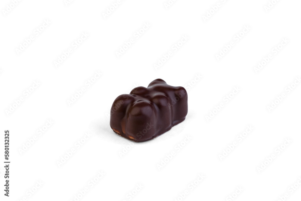 Souffle candy in chocolate in the shape of a bear on a white background. Souffle candy in chocolate in the shape of a bear on a white background.