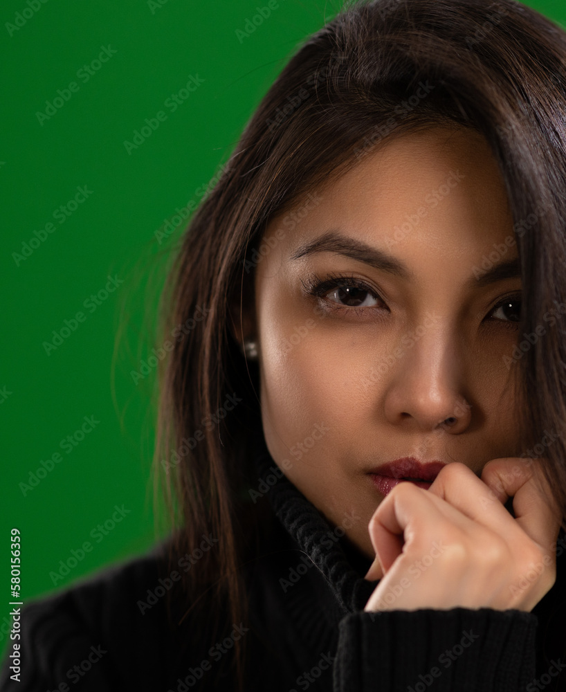 Young Asian woman with a beautiful face - portrait shot against color background. High quality photo Young Asian woman with a beautiful face - portrait shot against color background. High quality photo